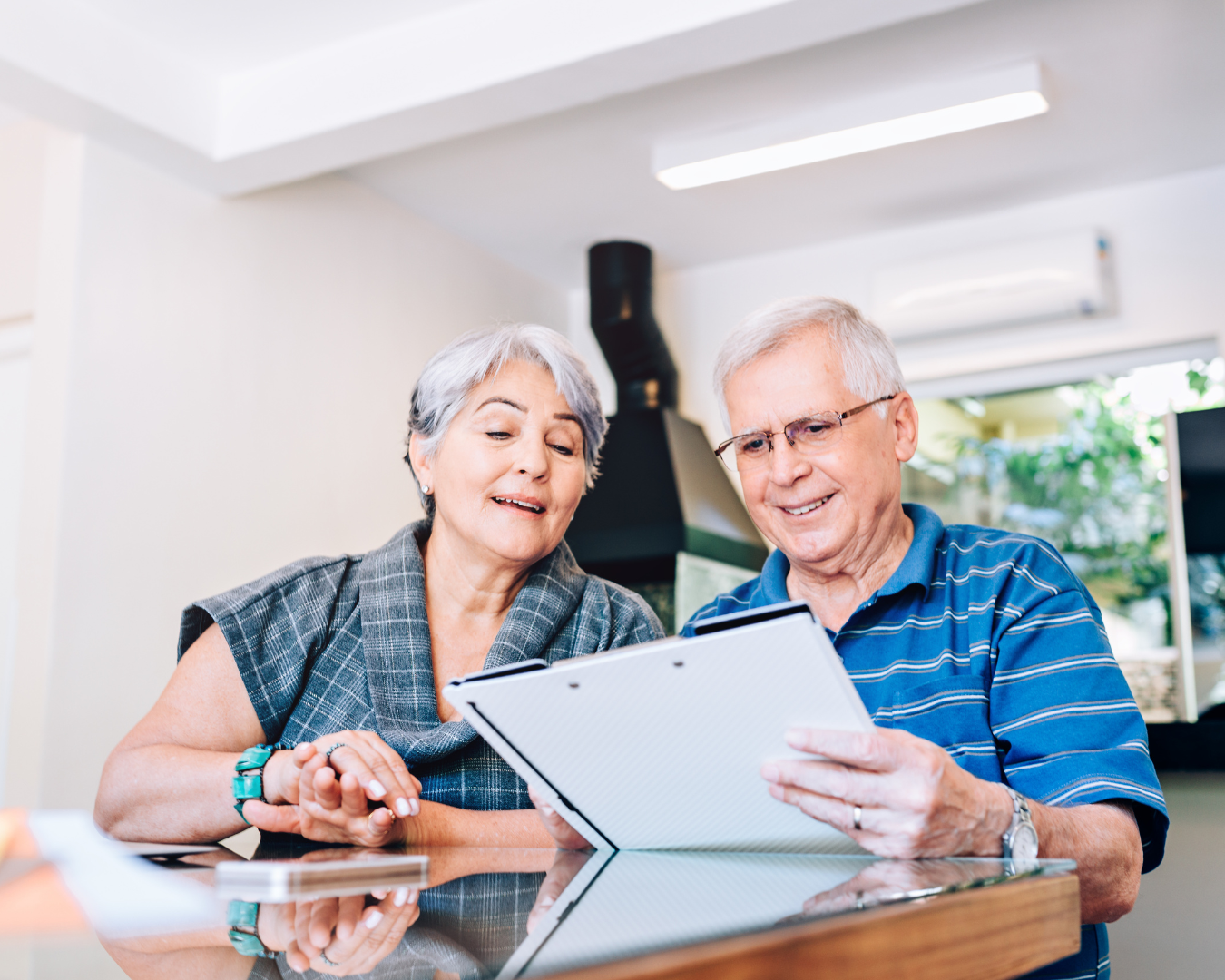 two-retired-people-look-at-paperwork